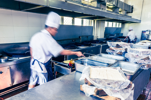 Chef in a commercial kitchen - compressed air testing